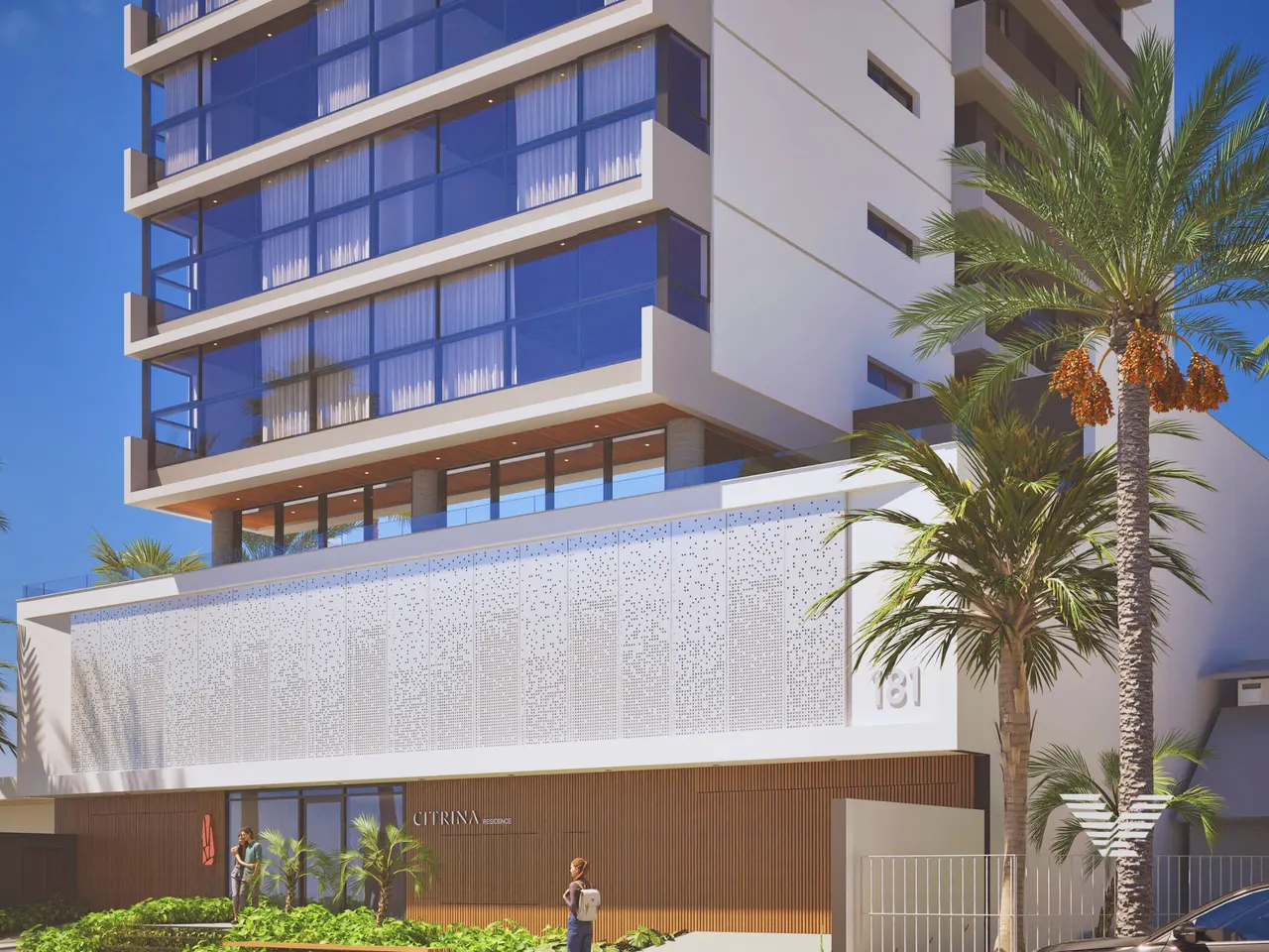 Fachada do Citrina Residence entre palmeiras, em Tubarão